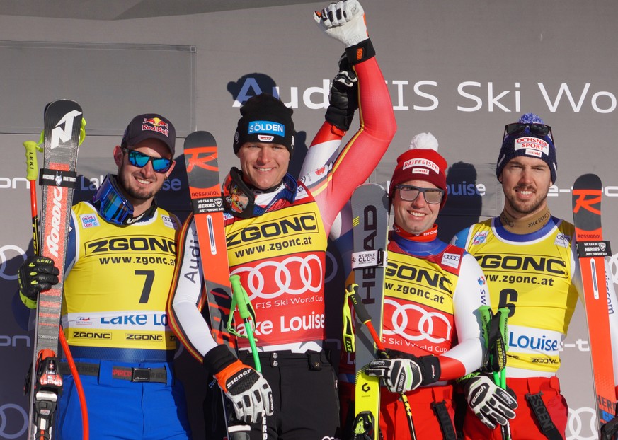 epa08036253 (L-R) Dominik Paris of Italy (2nd place) Thomas Dressen of Germany (1st place) Beat Feuz (L) and teammate Carlo Janka (R) of Switzerland (3rd place) at the Men&#039;s World Cup Alpine Down ...