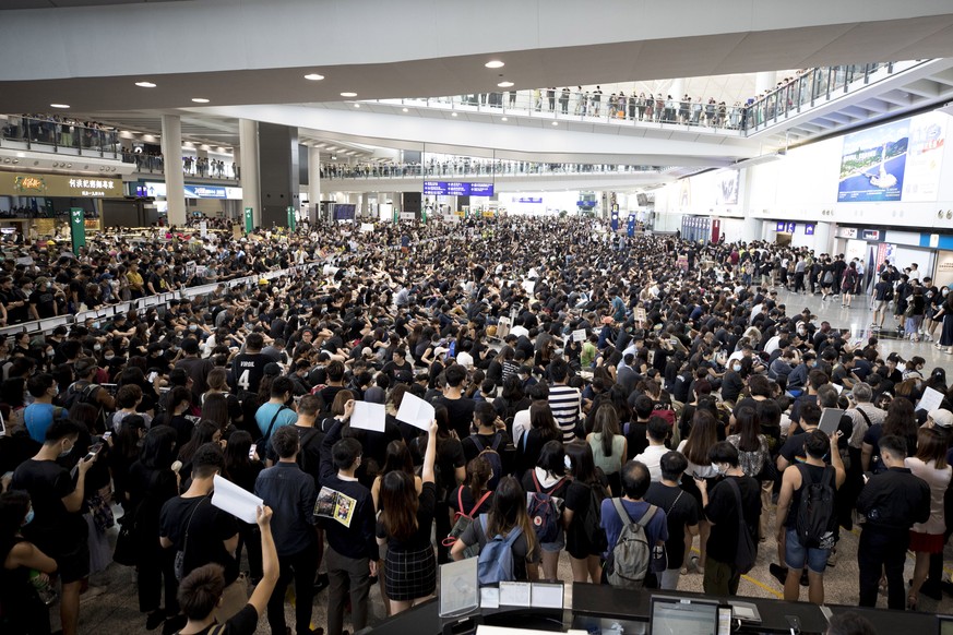 Protesters demonstrate at the airport in Hong Kong, Monday, Aug. 12, 2019. Several thousand people gathered on Monday for a fourth day of protest against a proposed extradition law at Hong Kong&#039;s ...
