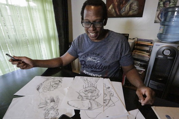 Kenyan cartoonist and commentator Patrick Gathara works on drawing cartoons at his house in Nairobi, Kenya, Thursday, Nov. 5, 2020. As the United States twists itself into knots over its most contenti ...