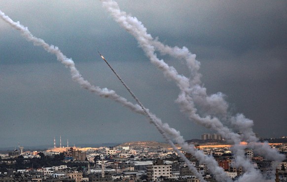 epaselect epa08244428 Rockets fired from Gaza fly towards Israel, in Gaza City, 24 February 2020. According to media reports, Islamic Jihad fired several rockets and mortars from Gaza towards Israel o ...