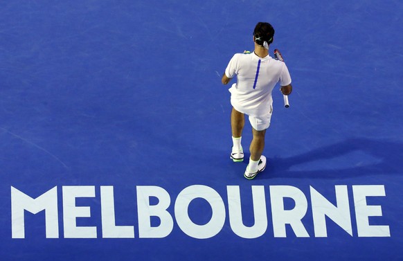 Roger Federer of Switzerland prepares to serve to Novak Djokovic of Serbia during their semifinal match at the Australian Open tennis championships in Melbourne, Australia, Thursday, Jan. 28, 2016.(AP ...