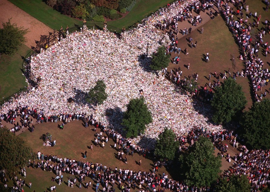FILE - This is an aerial view showing the large pile of flowers at the gates of Kensington Palace in London, as the crowds continue to arrive to pay their respects to the late Princess Diana, in this  ...