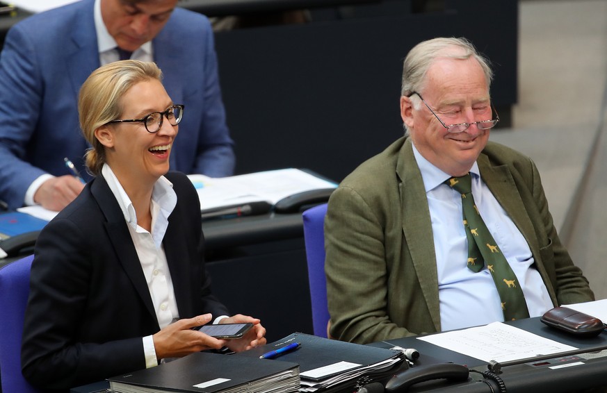 epa06737869 Co-chairs of the &#039;Alternative for Germany&#039; party (AfD) parliamentary group Alice Weidel (L) and Alexander Gauland (R) react during the presentation of the draft of the 2018 feder ...