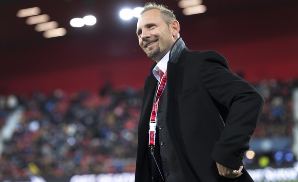 Switzerland&#039;s head coach Mauro Lustrinelli smiles before a qualification soccer match for the European Under 21 Championship between Switzerland and France at the Stadium Stade de la Maladiere, i ...