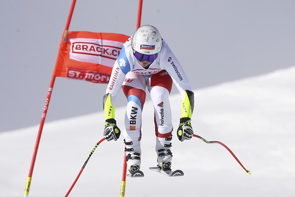 Switzerland&#039;s Corinne Suter speeds down the course during an alpine ski, women&#039;s World Cup super G in St. Moritz, Switzerland, Saturday, Dec. 14, 2019. (AP Photo/Alessandro Trovati)