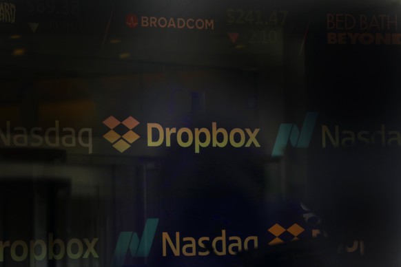 epa06624569 The Dropbox logo is seen at the Nasdaq Market site in Times Square in New York, USA, 23 March 2018. Dropbox, a cloud storage company, priced its initial public offering at 21 US dollars (U ...