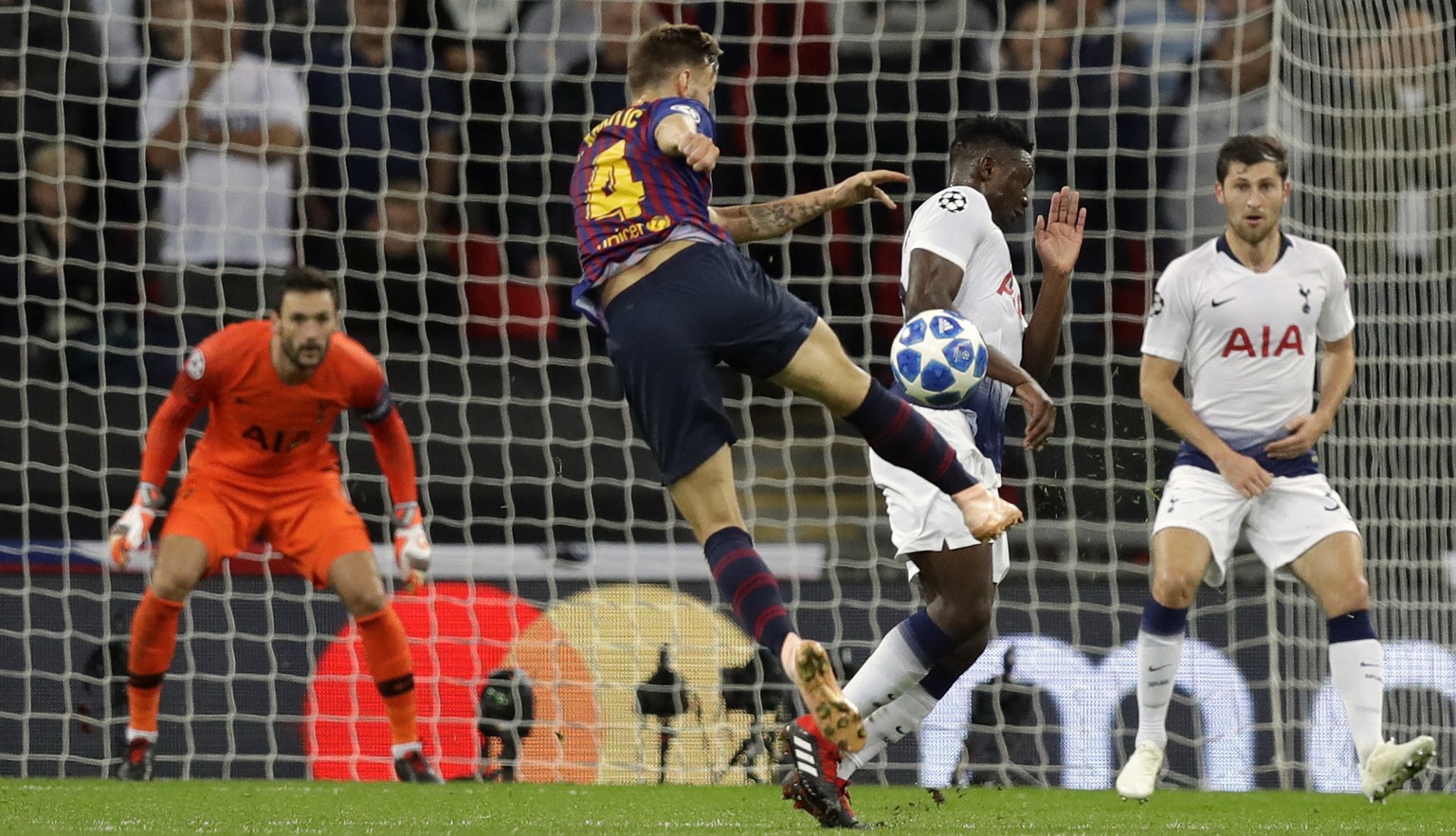 Barcelona midfielder Ivan Rakitic, center, scores his side&#039;s second goal during the Champions League Group B soccer match between Tottenham Hotspur and Barcelona at Wembley Stadium in London, Wed ...