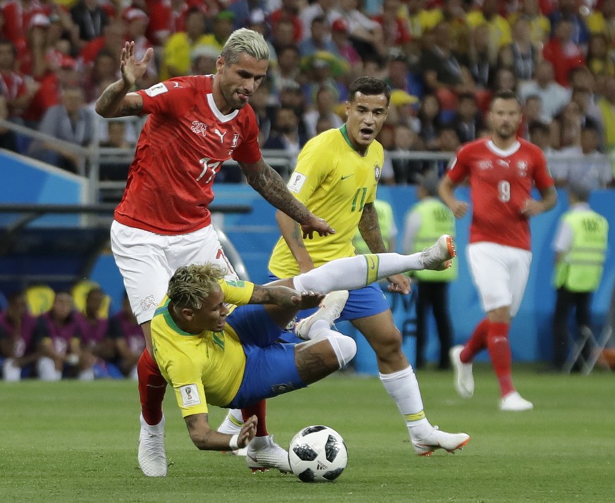 Switzerland&#039;s Valon Behrami, left, and Brazil&#039;s Neymar challenge for the ball during the group E match between Brazil and Switzerland at the 2018 soccer World Cup in the Rostov Arena in Rost ...
