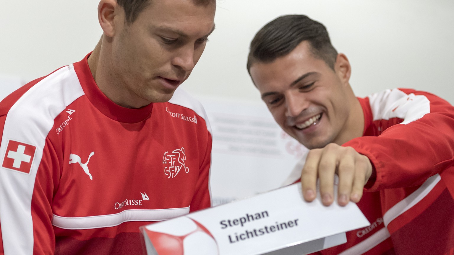 Stephan Lichtsteiner, left, and Granit Xhaka, right, attend a press conference of Switzerland&#039;s national soccer team, the day before the 2018 FIFA World Cup play-off second leg soccer match betwe ...