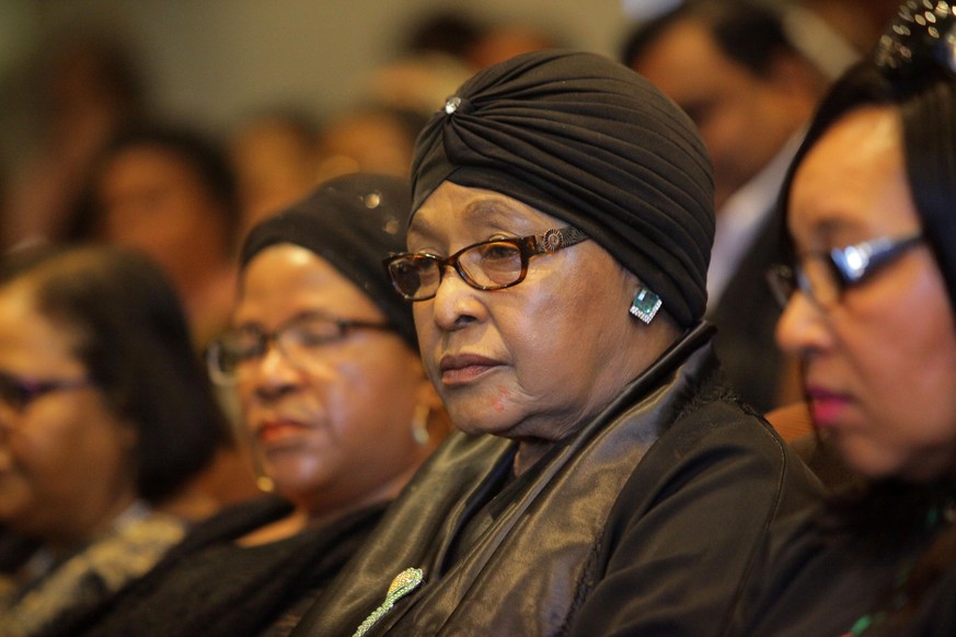 epa06641782 (FILE) - South African activist and politician Winnie Mandela (2-R) is seen at the Nelson Mandela Foundation in Houghton, to pay respect to the late South African anti-apartheid activist A ...