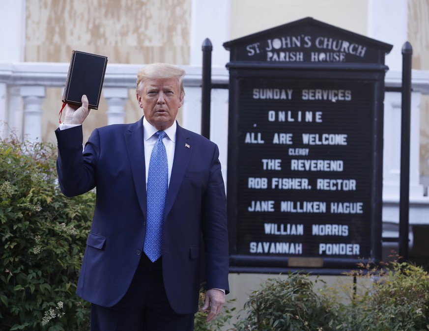 epa08939645 (FILE) US President Donald J. Trump poses with a bible outside St. John&#039;s Episcopal Church after delivering remarks in the Rose Garden at the White House in Washington, DC, USA, 01 Ju ...