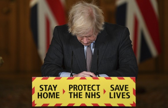 Prime Minister Boris Johnson reacts while leading a virtual news conference on the COVID-19 pandemic, inside 10 Downing Street in central London on Tuesday Jan. 26, 2021. Official data shows that more ...