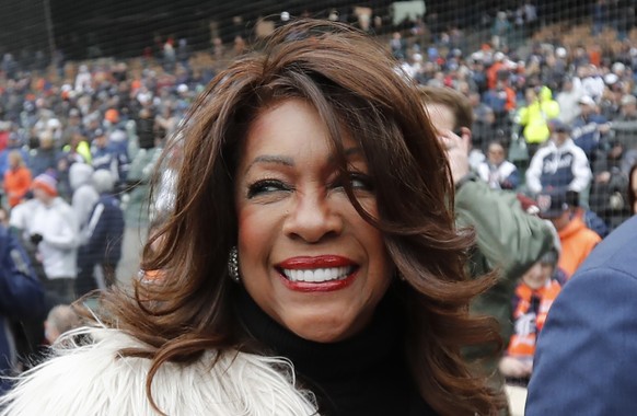 FILE - In this April 4, 2019, file photo, Mary Wilson, a former member of The Supremes, is escorted after singing the national anthem before a baseball game between the Detroit Tigers and the Kansas C ...