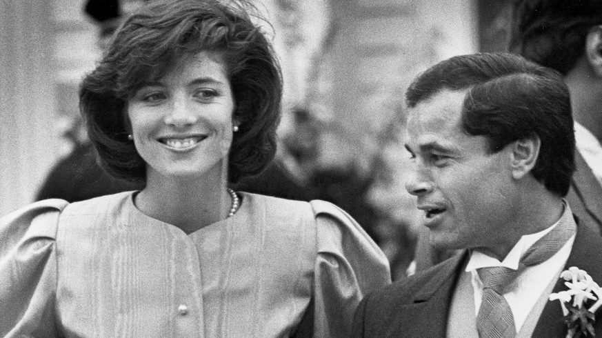 FILE - In this April 26, 1986 file photo, maid of Honor Caroline Kennedy and Best Man Franco Columbu, leave St. Francis Xavier Church after the wedding of Caroline&#039;s cousin Maria Shriver to Arnol ...