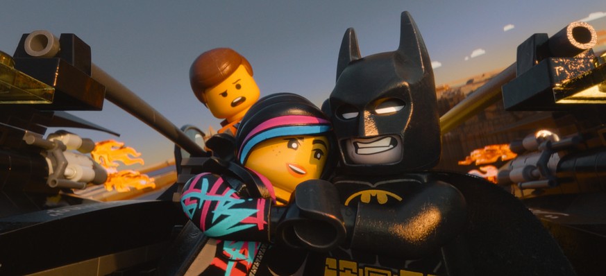 This image released by Warner Bros. Pictures shows characters, from left, Emmet, voiced by Chris Pratt, Wyldstyle, voiced by Elizabeth Banks and Batman, voiced by Will Arnett, in a scene from &quot;Th ...