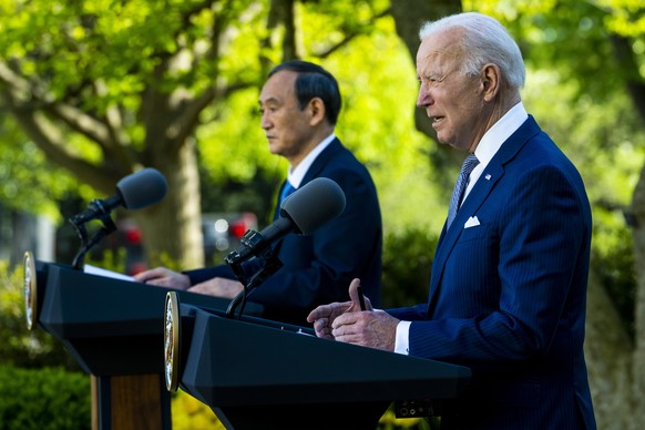 epa09140452 US President Joe Biden (R) and Prime Minister of Japan Suga Yoshihide (L) during a joint news conference at the White House, in Washington, DC, USA, 16 April 2021. EPA/Doug Mills / POOL