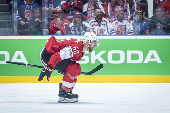 epa07588973 Switzerland&#039;s Tristan Scherwey celebrates after scoring during the IIHF World Championship group B ice hockey match between the Czech Republic and Switzerland at the Ondrej Nepela Are ...