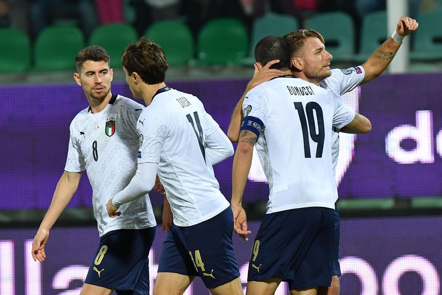 Italy&#039;s Ciro Immobile, right, celebrates with teammates after scoring his side&#039;s first goal during a group J qualifying soccer match between Italy and Armenia at the Renzo Barbera stadium, i ...