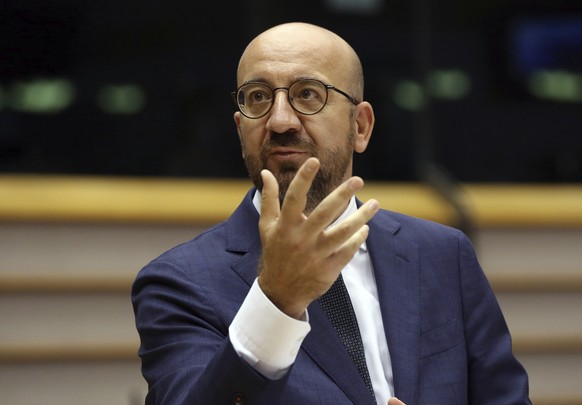 European Council President Charles Michel addresses European lawmakers at the European Parliament in Brussels, Thursday, July 23, 2020. European leaders took a historic step towards sharing financial  ...