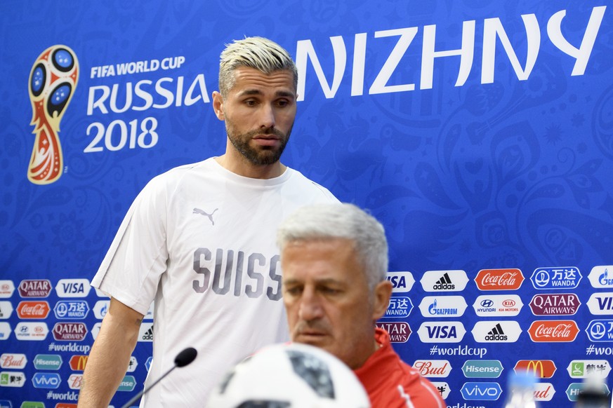 Switzerland&#039;s midfielder Valon Behrami, left, and Switzerland&#039;s head coach Vladimir Petkovic, right, arrives for a press conference on the eve of the FIFA World Cup 2018 group E preliminary  ...
