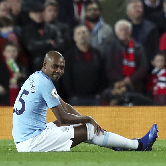 Manchester City&#039;s Fernandinho sits on the pitch during the English Premier League soccer match between Manchester United and Manchester City at Old Trafford Stadium in Manchester, England, Wednes ...