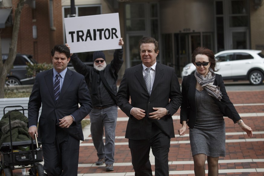 epa07020051 (FILE) - Former Trump Campaign Manager Paul Manafort (C), with his wife Kathleen Manafort (R), arrives for arraignment at the Federal Courthouse in Alexandria, Virginia, USA, 08 March 2018 ...