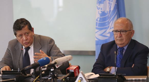 Marzuki Darusman, left, chair of the UN fact-finding mission on Myanmar gestures and Christopher Sidoti, right, an international human rights lawyer, listen during a press conference in Jakarta, Indon ...