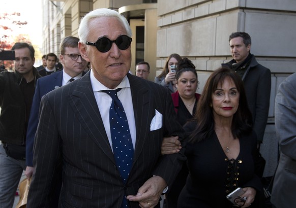 Roger Stone, left, with his wife Nydia Stone, leaves federal court in Washington, Friday, Nov. 15, 2019. Stone, a longtime friend of President Donald Trump, has been found guilty at his trial in feder ...