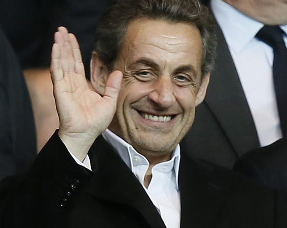 epa04293145 (FILE) A file photo dated 02 April 2014 of former French President Nicolas Sarkozy waving as he arrives to watch the UEFA Champions League quarter final first leg soccer match between Pari ...