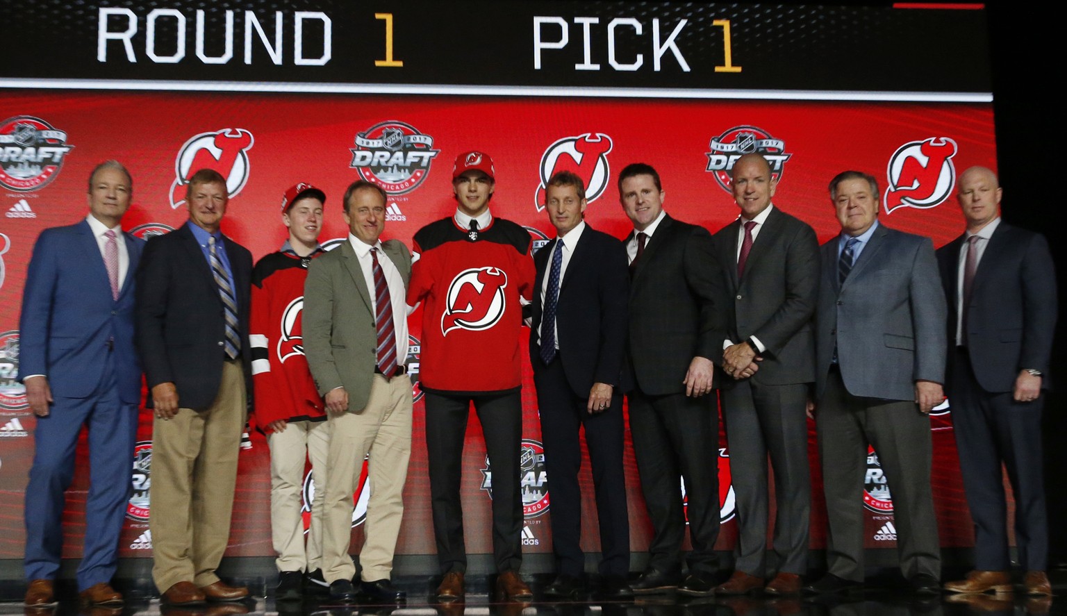 Center Nico Hischier holds a New Jersey Devils jersey after being selected by the team in the first round of the NHL hockey draft, Friday, June 23, 2017, in Chicago. (AP Photo/Nam Y. Huh)