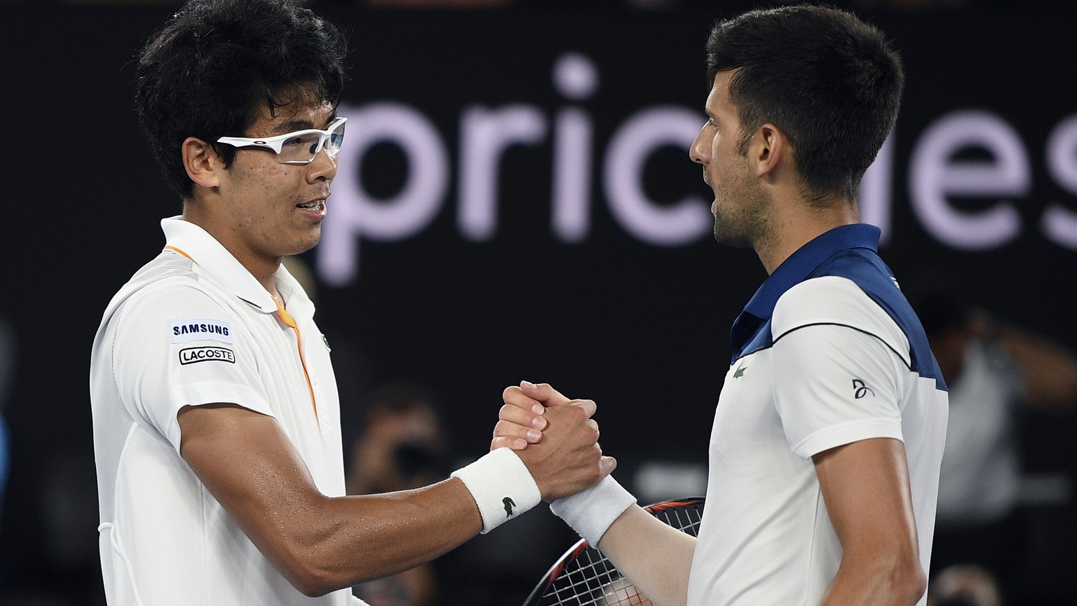 South Korea&#039;s Chung Hyeon, left, is congratulated by Serbia&#039;s Novak Djokovic after winning their fourth round match at the Australian Open tennis championships in Melbourne, Australia, Monda ...