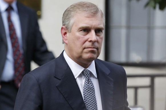 FILE - In this Wednesday, June 6, 2012 file photo, Britain&#039;s Prince Andrew leaves King Edward VII hospital in London after visiting his father Prince Philip. The woman who says she was a traffick ...