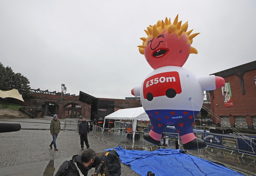 A blimp of Britain&#039;s Prime Minister Boris Johnson is inflated as part of the Reject Brexit defend our democracy protest, before the Conservative party conference in Manchester, England, Sunday, S ...