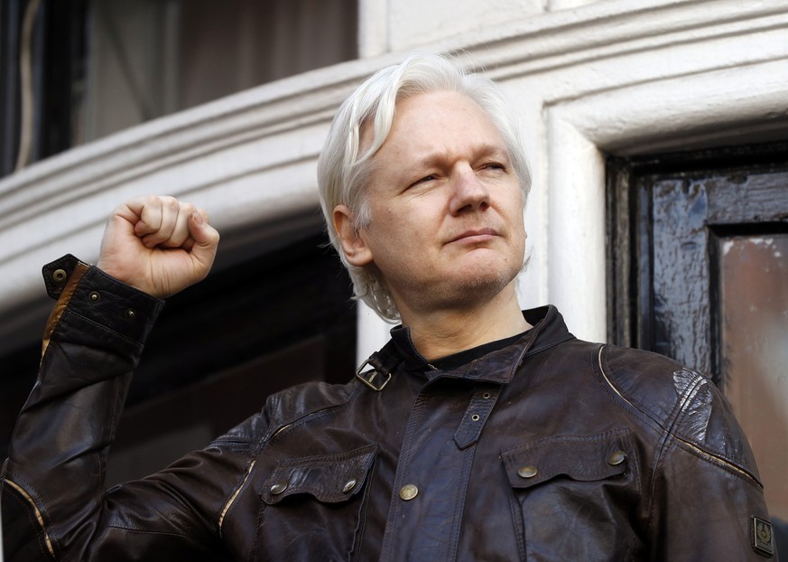 FILE - In this May 19, 2017 file photo, Julian Assange greets supporters outside the Ecuadorian embassy in London. Ecuador’s government released a statement Wednesday, Nov. 22, once again calling on A ...