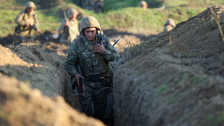 Armenian soldiers take their position on the front line in Tavush region, Armenia, Tuesday, July 14, 2020. Skirmishes on the volatile Armenia-Azerbaijan border escalated Tuesday, marking the most seri ...