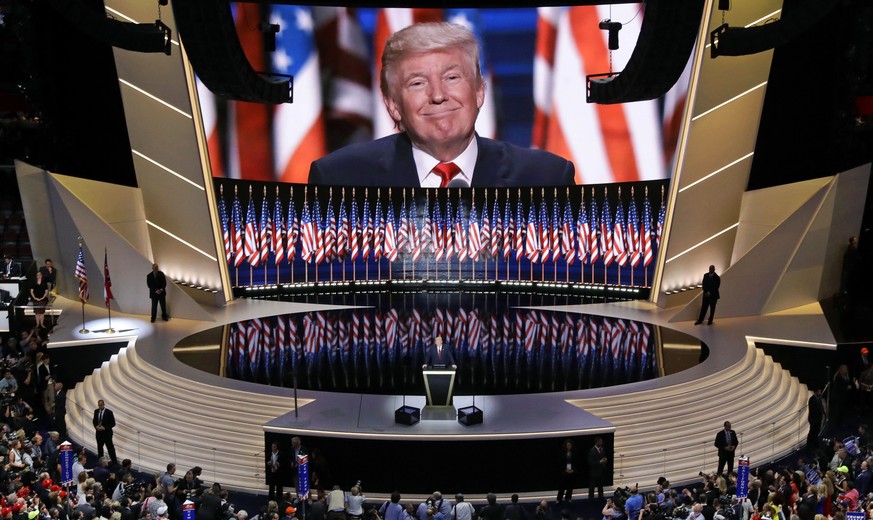 In this July 21, 2016 photo, Republican presidential candidate Donald Trump smiles as he addresses delegates during the final day session of the Republican National Convention in Cleveland. For eight  ...