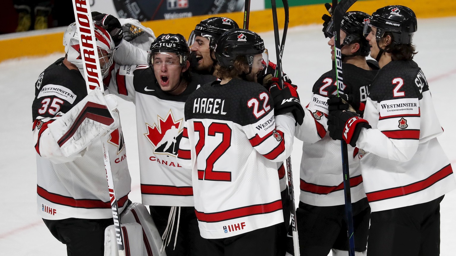 epa09249455 Players of Canada celebrate after winning the IIHF 2021 World Ice Hockey Championship semifinal match between the USA and Canada at the Arena Riga, Latvia, 05 June 2021. EPA/TOMS KALNINS