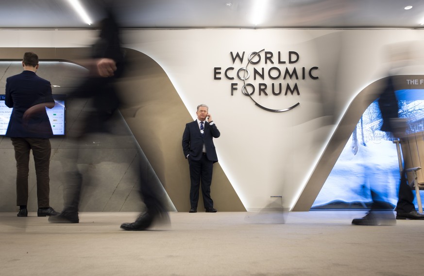 epa08868577 FILE - Participants walk trough the halls during the 49th annual meeting of the World Economic Forum, WEF, in Davos, Switzerland, 24 January 2019 (reissued 07 December 2020). The next WEF  ...