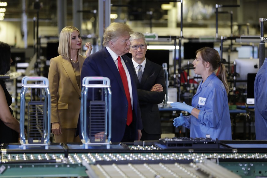 President Donald Trump tours an Apple manufacturing plant, Wednesday, Nov. 20, 2019, in Austin with Apple CEO Tim Cook and Ivanka Trump, the daughter and adviser of President Donald Trump, left. (AP P ...