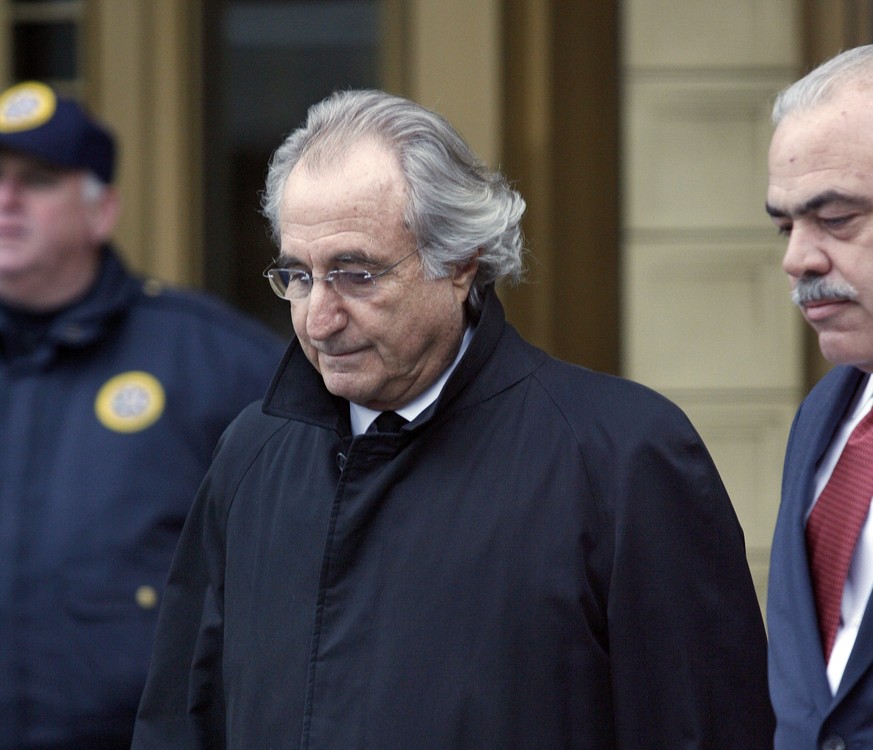 FILE - In this Jan. 14, 2009 file photo, Bernie Madoff leaves Federal Court in New York. Madoff, the financier who pleaded guilty to orchestrating the largest Ponzi scheme in history, died early Wedne ...