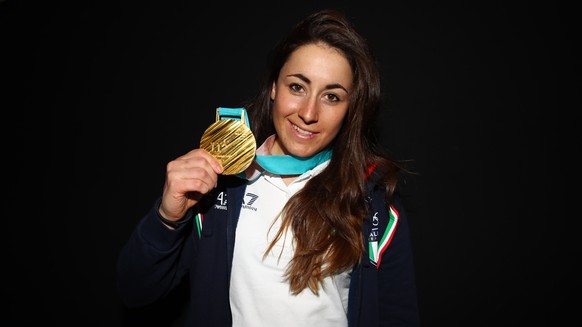 Italy&#039;s Sofia Goggia poses with her gold medal for the women&#039;s downhill at Casa Italia during the 2018 Winter Olympics in Pyeongchang, South Korea, Thursday, Feb. 22, 2018. (AP Photo/Alessan ...