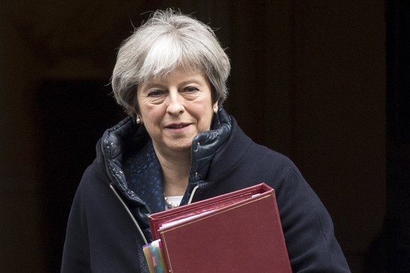 epa06598986 (FILE) - British Prime Minister Theresa May leaves Downing Street to attend Prime Minister Questions in the House of Commons, Central London, Britain, 07 March 2018 (reissued 12 March 2018 ...