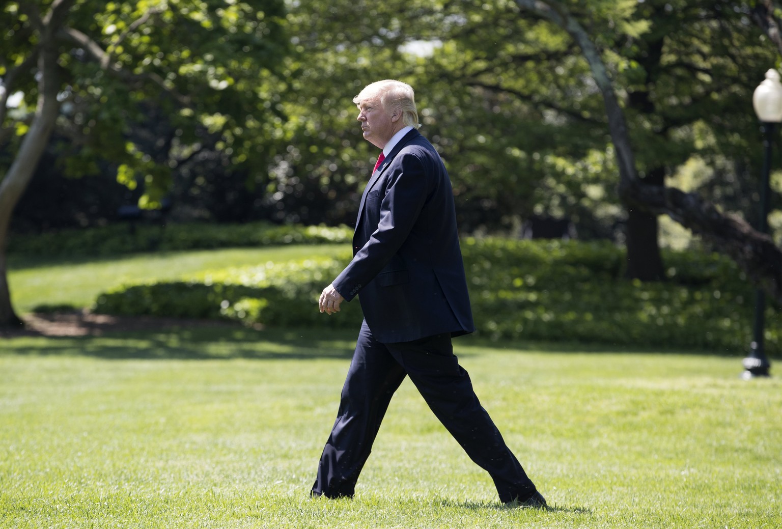 epa05933260 US President Donald J. Trump walks across the South Lawn of the White House to depart by Marine One, in Washington, DC, USA, 28 April 2017. Trump travels to Georgia where he will deliver r ...