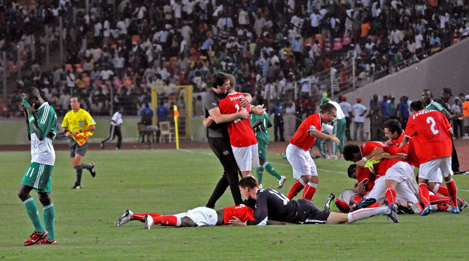 Switzerland soccer players react after beating Nigeria during their U 17 World Cup soccer Final match in Abuja, Nigeria, Sunday, Nov. 15, 2009. (AP Photo/Sunday Alamba)