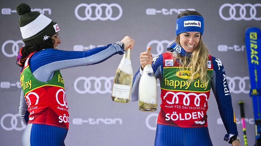 epa08752560 Second placed Federica Brignone (L) of Italy and winner Marta Bassino of Italy, react after the women&#039;s Giant Slalom race of the FIS Alpine Skiing World Cup season opener in Soelden,  ...