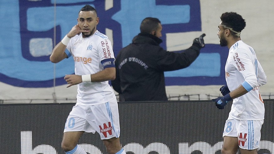 Marseille&#039;s Dimitri Payet, left, celebrates with teammate Jordan Amavi after scoring during the League One soccer match between Marseille and Troyes, at the Velodrome stadium, in Marseille, south ...