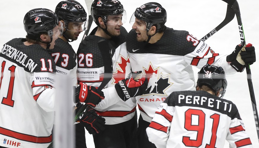 Canada&#039;s players celebrate after Canada&#039;s Cole Perfetti scored his side&#039;s third goal during the Ice Hockey World Championship group B match between Kazakhstan and Canada at the Arena in ...