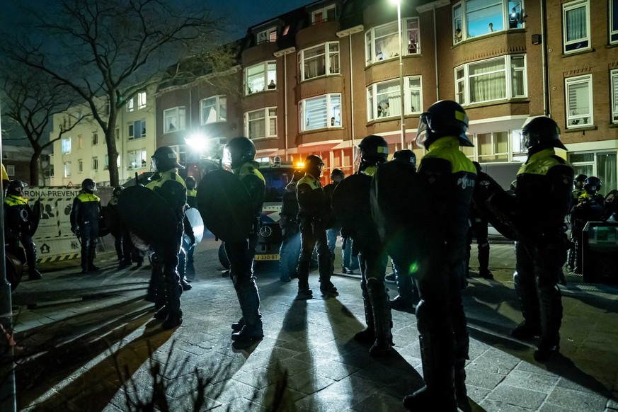 epa08967422 Police is stationed in the Beijerlandselaan area in Rotterdam, The Netherlands, 26 January 2021. In South Rotterdam and in the city center, several people were arrested for, among other th ...