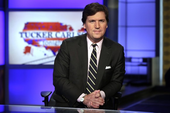 FILE - In this March 2, 2017 file photo, Tucker Carlson, host of &quot;Tucker Carlson Tonight,&quot; poses for photos in a Fox News Channel studio, in New York. Carlson, who on Monday&#039;s show addr ...