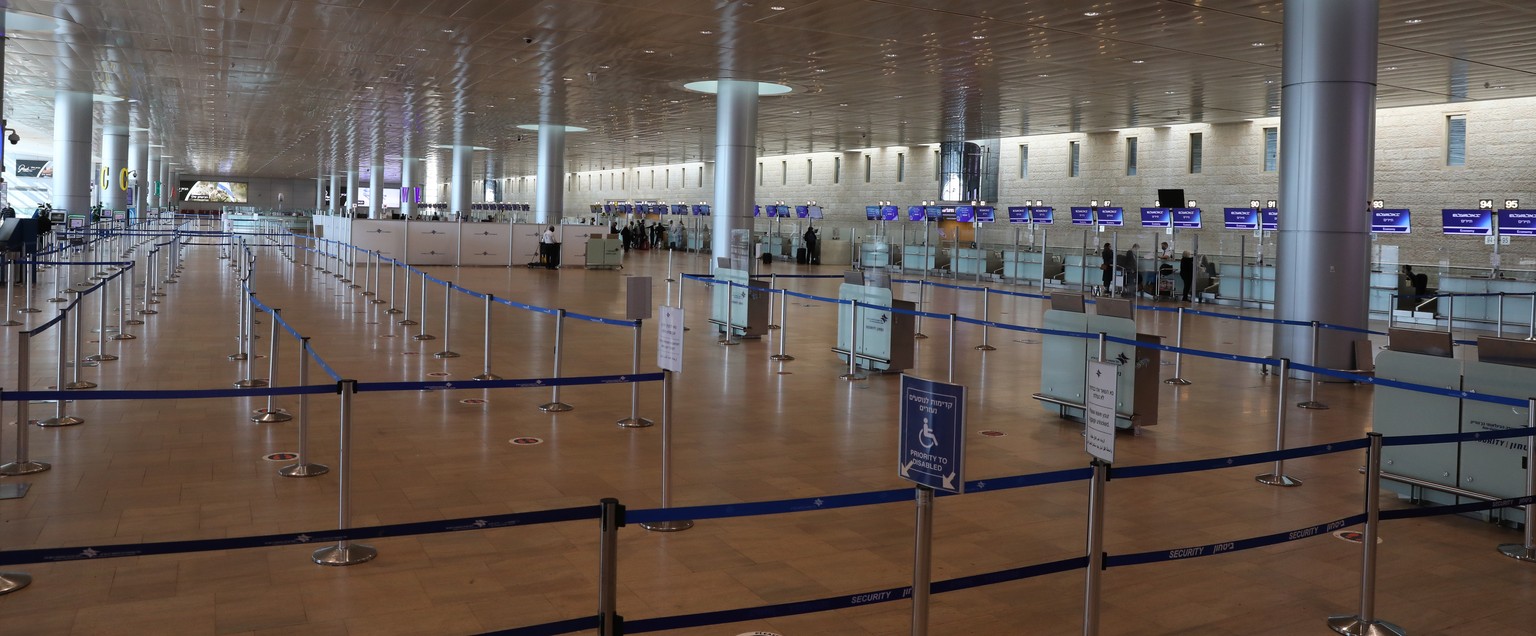 epa08963905 A view on the deserted departure hall and empty check-out stations at Ben Gurion International Airport near Tel Aviv, Israel, 25 January 2021. Media report that government approved a total ...